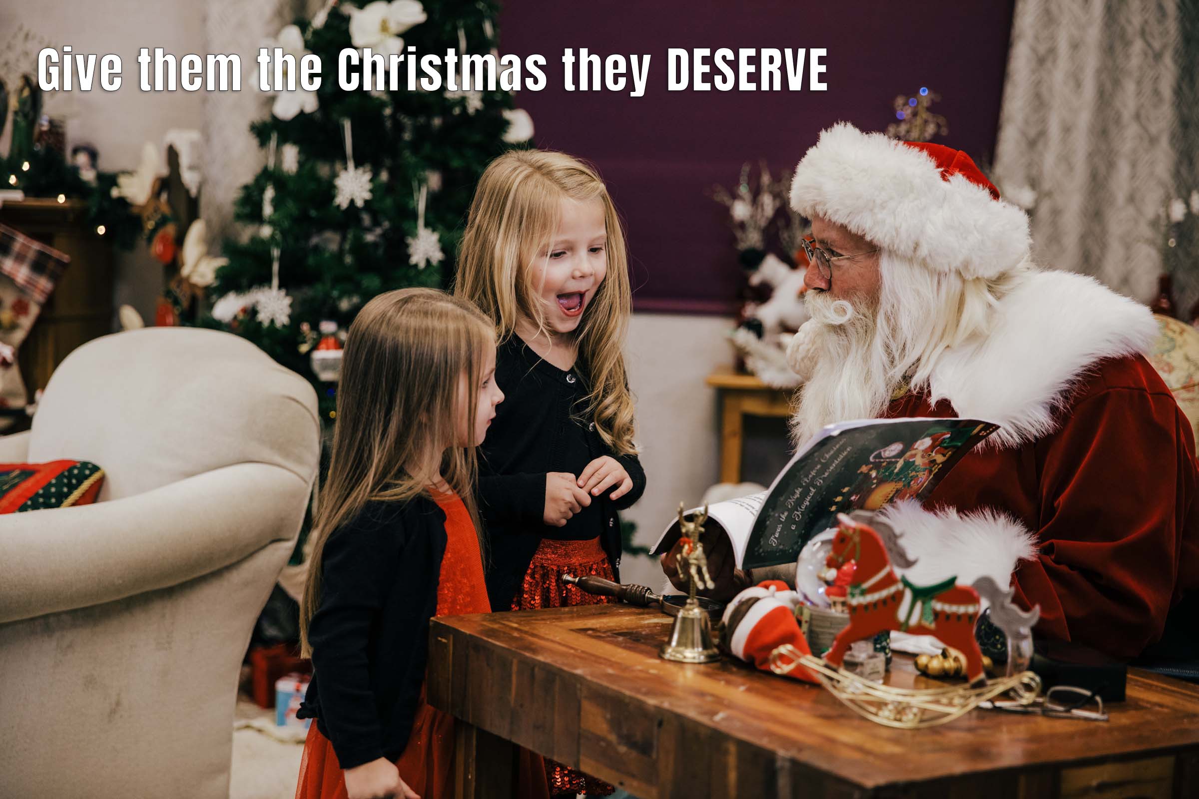 Image says "Give them the Christmas they deserve" and it shows two little girls looking at Santa and smiling big at him delighted