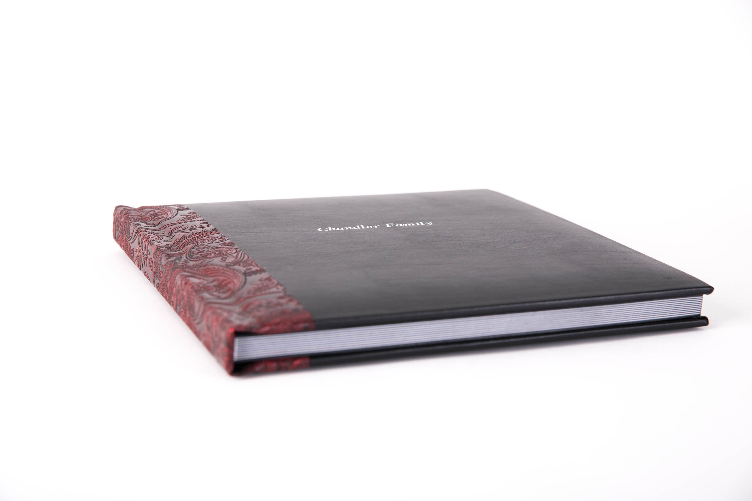 Beautiful luxe heirloom album with black leather cover and red leather tooled binding